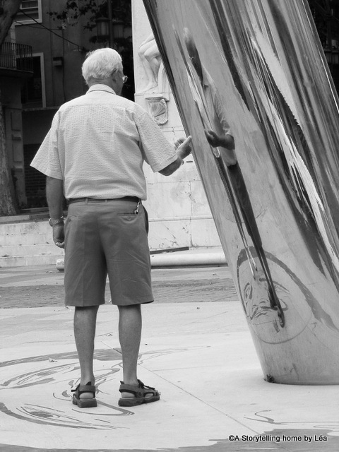 Man playing with a Dali themed installation, Figueras