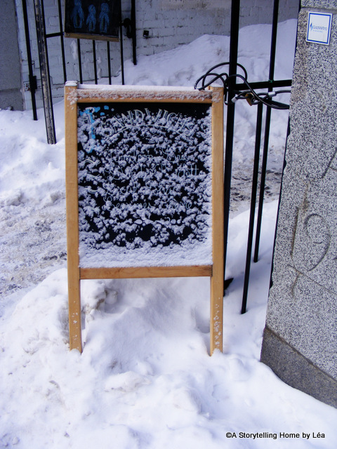 Outdoor sign covered in snow